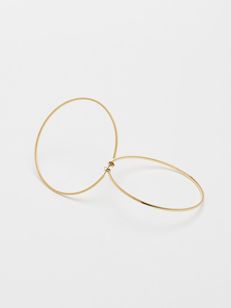Detail flat lay view of the XL Oversized Simple Gold Hoops Earrings Bagatiba 