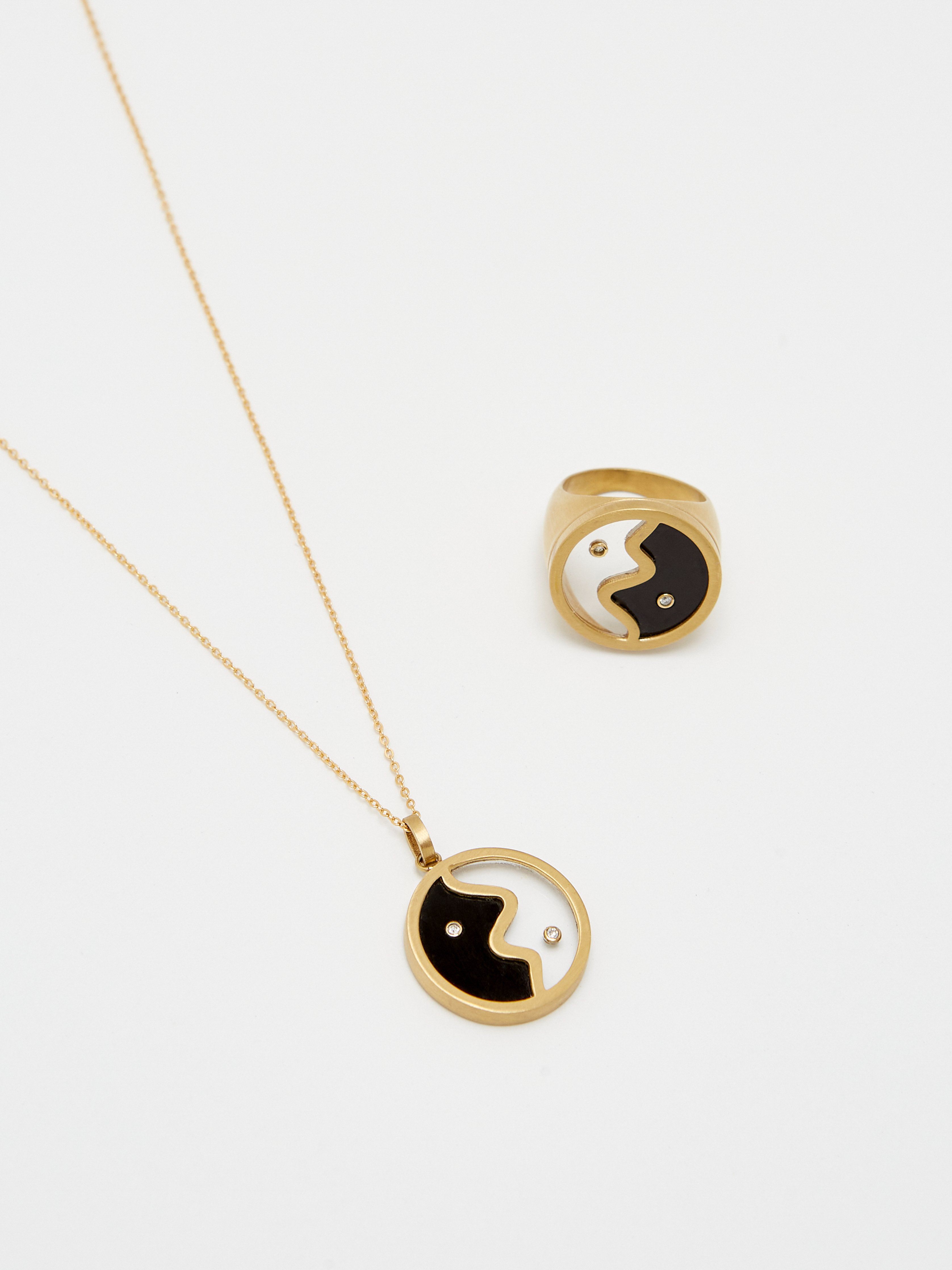 Detail view flat lay of the Yin Yang Glass Necklace and Ring by  bagatiba 
