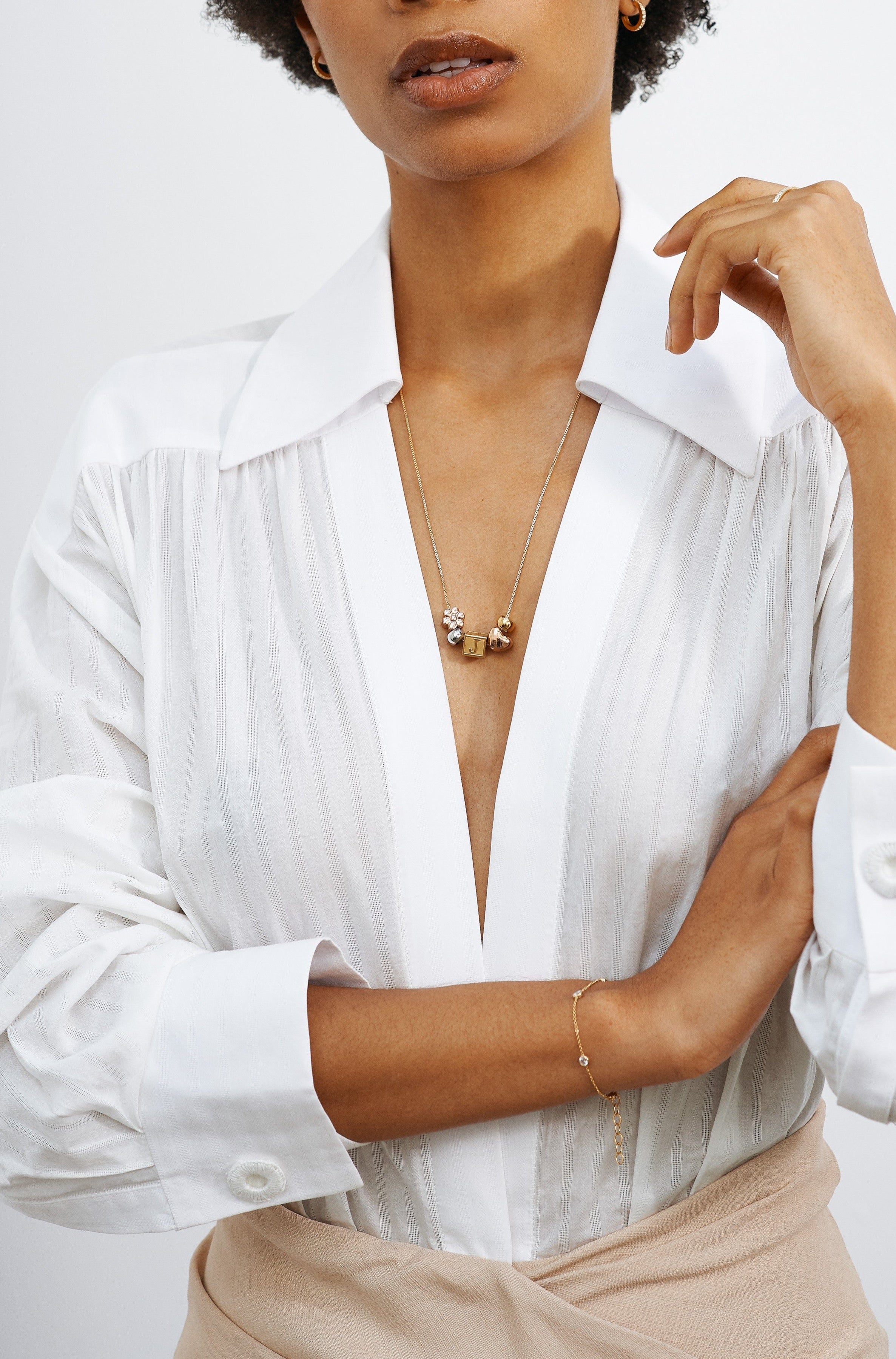 Model wearing "J" Letter Block letter on long chain with beads Bagatiba